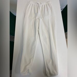 Meshki joggers with side pocket embroidery, drawstring, and pockets. Size xs.